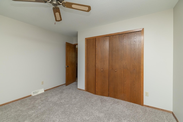 110 Hamilton Dr, River Falls, WI 54022 - unfurnished bedroom with carpet flooring, a closet, and a ceiling fan