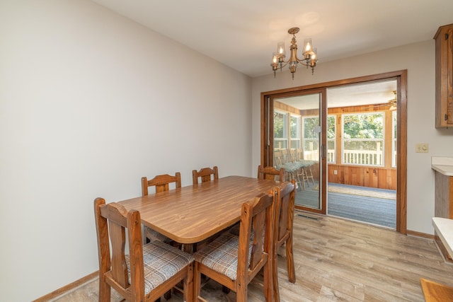 110 Hamilton Dr, River Falls, WI 54022 - dining space featuring a chandelier and light wood finished floors