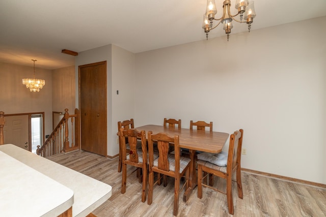 110 Hamilton Dr, River Falls, WI 54022 - dining room featuring a chandelier and light wood-type flooring
