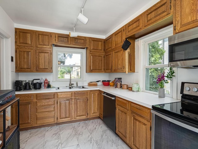 5529 1st Ave S, Minneapolis, MN 55419 - kitchen featuring stainless steel appliances, light countertops, and brown cabinetry