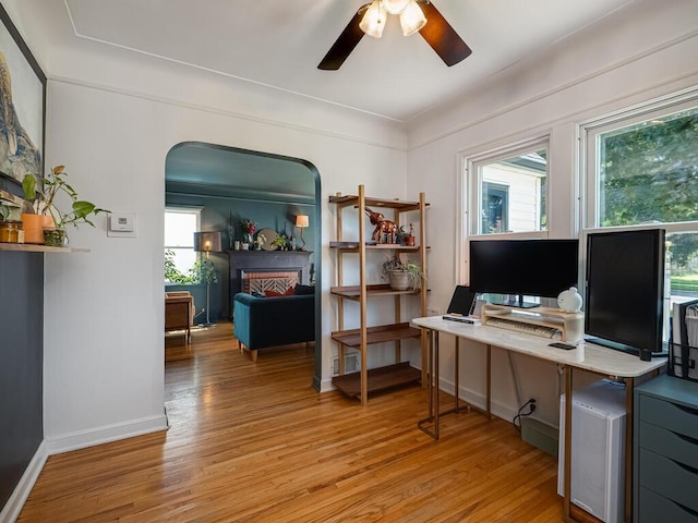 5529 1st Ave S, Minneapolis, MN 55419 - office with arched walkways, ceiling fan, light wood finished floors, and a fireplace