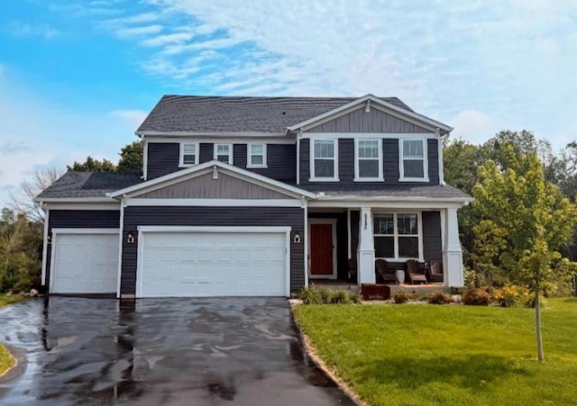 6285 Graiton Ct S, Cottage Grove, MN 55016 - view of front facade with a porch, driveway, a garage, and a front yard