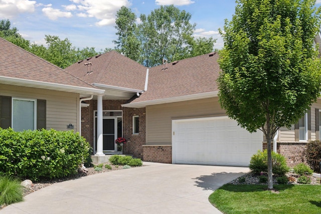 11444 Clarion Way, Minnetonka, MN 55343 - view of front of property with brick siding, concrete driveway, an attached garage, and a shingled roof