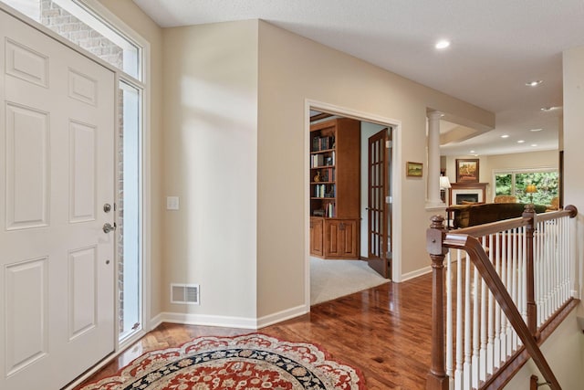 11444 Clarion Way, Minnetonka, MN 55343 - foyer with wood finished floors, recessed lighting, and decorative columns