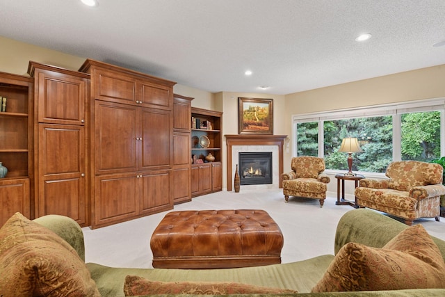 11444 Clarion Way, Minnetonka, MN 55343 - living area with light colored carpet, a glass covered fireplace, recessed lighting, and a textured ceiling