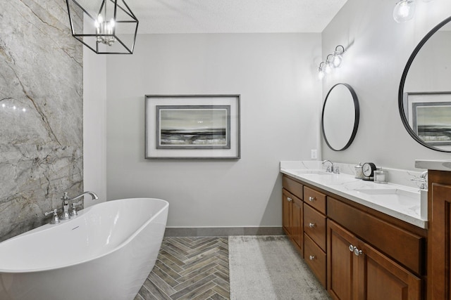 11444 Clarion Way, Minnetonka, MN 55343 - full bath with double vanity, a soaking tub, a chandelier, and a textured ceiling