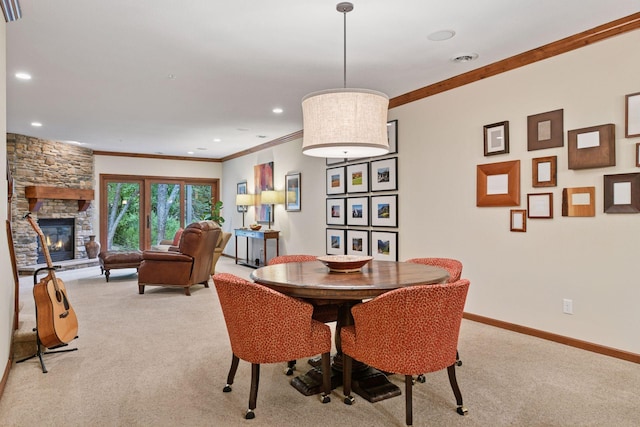 11444 Clarion Way, Minnetonka, MN 55343 - dining area with light carpet, ornamental molding, a fireplace, and recessed lighting