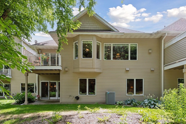 11444 Clarion Way, Minnetonka, MN 55343 - rear view of house with a shingled roof and a balcony