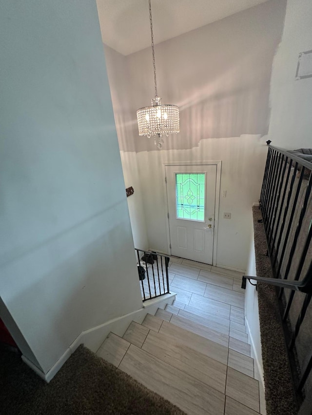 2728 111th Ave NW, Coon Rapids, MN 55433 - foyer entrance with a chandelier and stairs