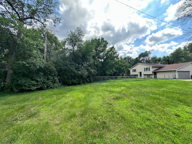 2728 111th Ave NW, Coon Rapids, MN 55433 - view of yard featuring an attached garage