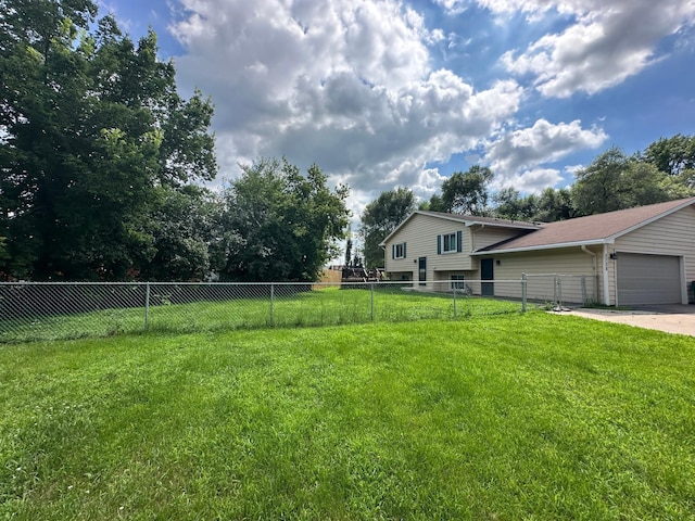 2728 111th Ave NW, Coon Rapids, MN 55433 - view of yard featuring concrete driveway and a garage