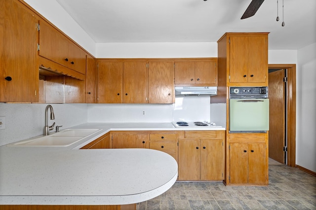 520 Park Island Rd Unit 2, Center City, MN 55012 - kitchen with oven, under cabinet range hood, ceiling fan, electric cooktop, and light countertops