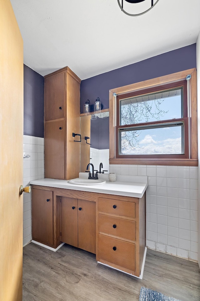 520 Park Island Rd Unit 2, Center City, MN 55012 - bathroom with tile walls, vanity, wood finished floors, and a wainscoted wall