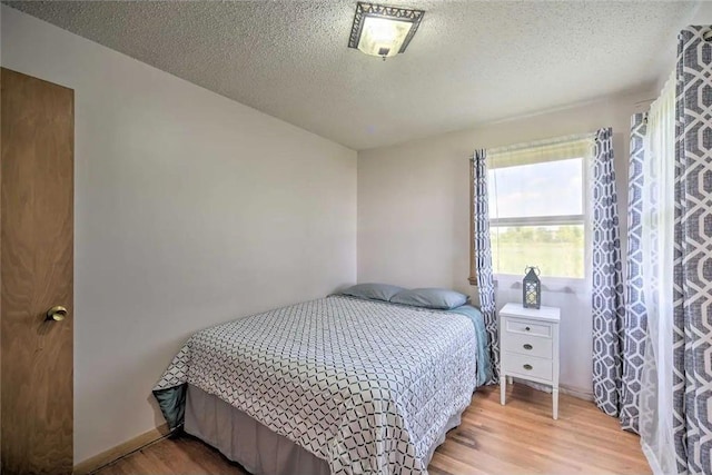 520 Park Island Rd Unit 2, Center City, MN 55012 - bedroom featuring wood finished floors and a textured ceiling