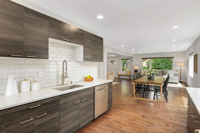 4640 Portland Ave, Minneapolis, MN 55407 - kitchen featuring stainless steel dishwasher, dark brown cabinets, backsplash, recessed lighting, and wood finished floors