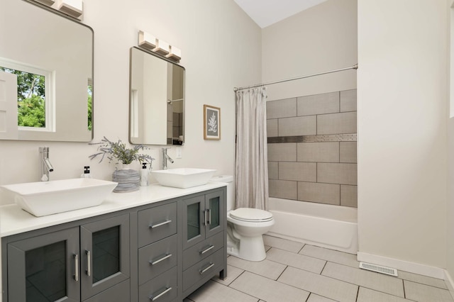 4640 Portland Ave, Minneapolis, MN 55407 - bathroom with double vanity, shower / tub combo with curtain, and tile patterned flooring