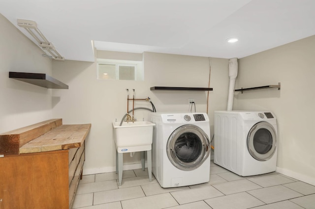 4640 Portland Ave, Minneapolis, MN 55407 - laundry area featuring washer and dryer, light tile patterned flooring, and recessed lighting