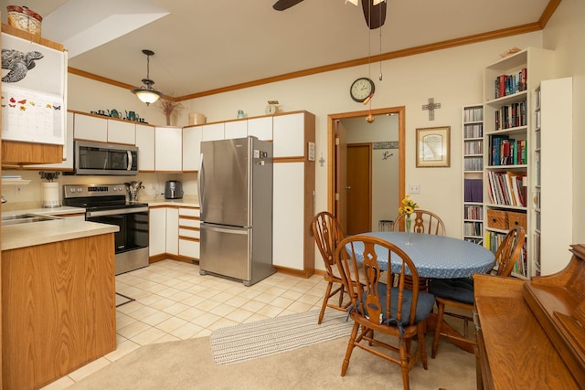 1925 Cabernet Ln NW, Rochester, MN 55901 - kitchen with stainless steel appliances, crown molding, light countertops, ceiling fan, and light tile patterned floors