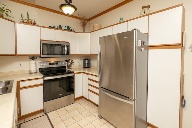 1925 Cabernet Ln NW, Rochester, MN 55901 - kitchen featuring appliances with stainless steel finishes, light countertops, ornamental molding, light tile patterned floors, and white cabinets
