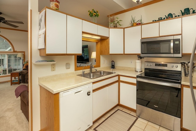 1925 Cabernet Ln NW, Rochester, MN 55901 - kitchen featuring appliances with stainless steel finishes, crown molding, ceiling fan, light countertops, and light tile patterned flooring