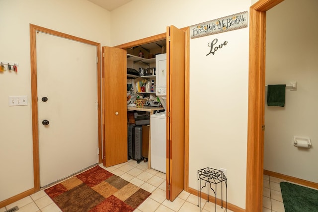 1925 Cabernet Ln NW, Rochester, MN 55901 - washroom with stacked washing machine and dryer and light tile patterned floors