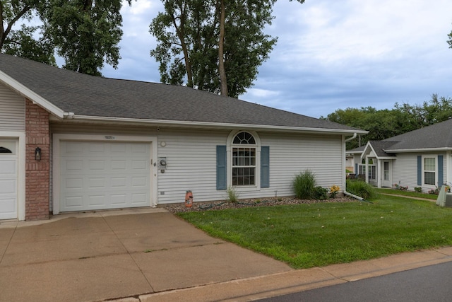 1925 Cabernet Ln NW, Rochester, MN 55901 - ranch-style home with driveway, a front yard, a garage, and a shingled roof