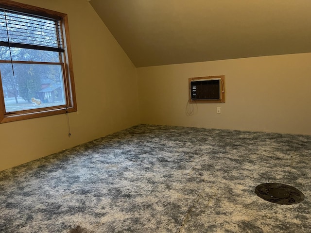 77 Morgan St, Tracy, MN 56175 - bonus room featuring a wall unit AC, carpet, and lofted ceiling