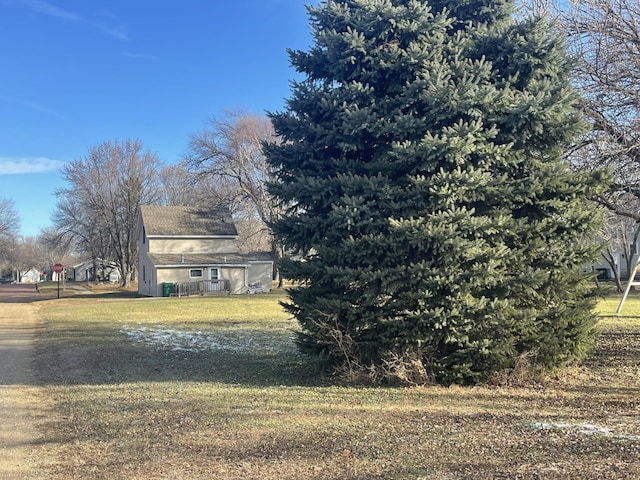 77 Morgan St, Tracy, MN 56175 - view of property exterior featuring a lawn