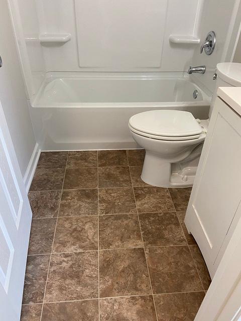 1340 119th Ln NW, Coon Rapids, MN 55448 - full bath featuring washtub / shower combination and vanity