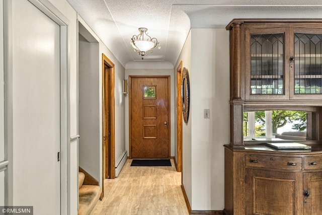 26 Golden Lake Rd, Circle Pines, MN 55014 - hallway featuring light wood-style flooring and a textured ceiling