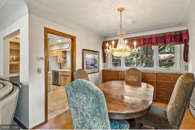 26 Golden Lake Rd, Circle Pines, MN 55014 - dining area with a chandelier and a baseboard heating unit
