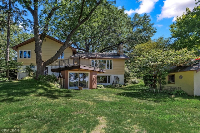 26 Golden Lake Rd, Circle Pines, MN 55014 - back of house featuring a lawn and a wooden deck