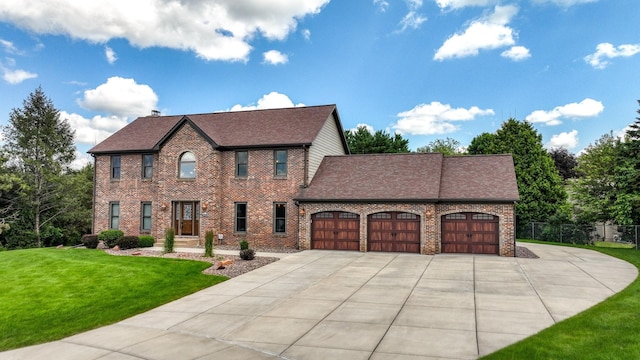 3946 Woodcrest Ct, Eau Claire, WI 54701 - view of front of house with an attached garage, concrete driveway, brick siding, and roof with shingles