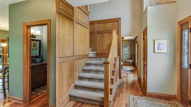 3946 Woodcrest Ct, Eau Claire, WI 54701 - staircase featuring wood finished floors