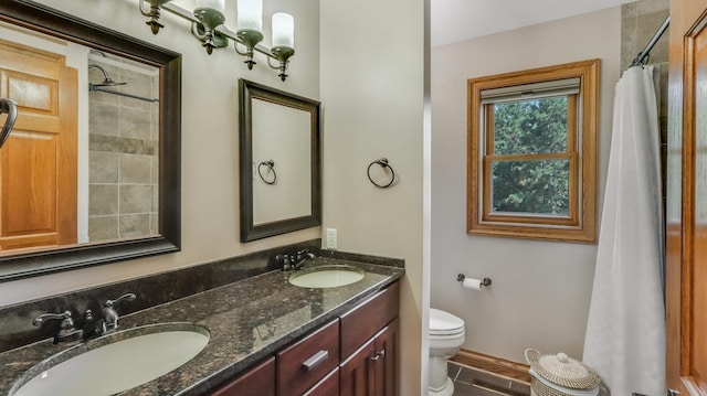 3946 Woodcrest Ct, Eau Claire, WI 54701 - bathroom featuring double vanity and curtained shower