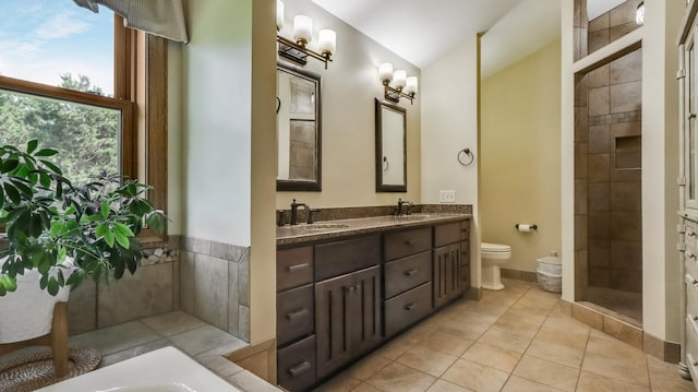 3946 Woodcrest Ct, Eau Claire, WI 54701 - full bathroom with double vanity, a tub to relax in, a tile shower, and tile patterned flooring