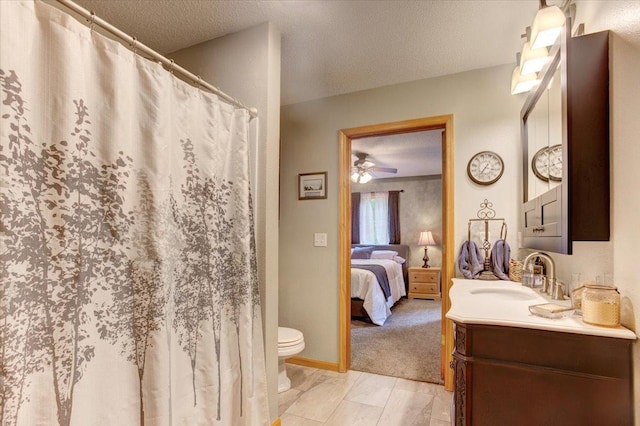 N12943 600th St, Wilson, WI 54772 - bathroom featuring vanity, a textured ceiling, ensuite bath, a ceiling fan, and a shower with curtain