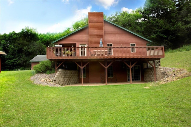 N12943 600th St, Wilson, WI 54772 - back of house featuring a patio, a deck, a yard, and a chimney