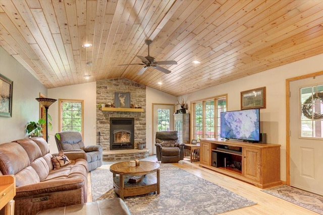 N12943 600th St, Wilson, WI 54772 - living area with wooden ceiling, lofted ceiling, a fireplace, plenty of natural light, and light wood-type flooring