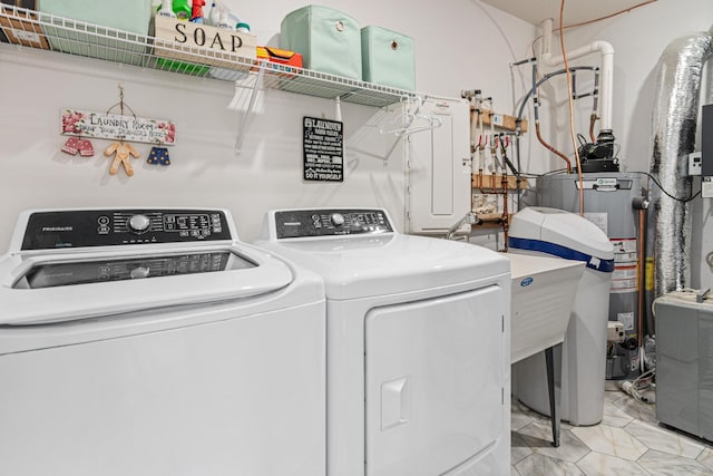 11374 81st St NE, Otsego, MN 55330 - laundry area featuring washer and dryer and water heater