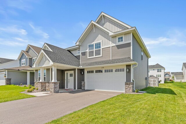 11374 81st St NE, Otsego, MN 55330 - craftsman-style house featuring board and batten siding, stone siding, a garage, and a front yard