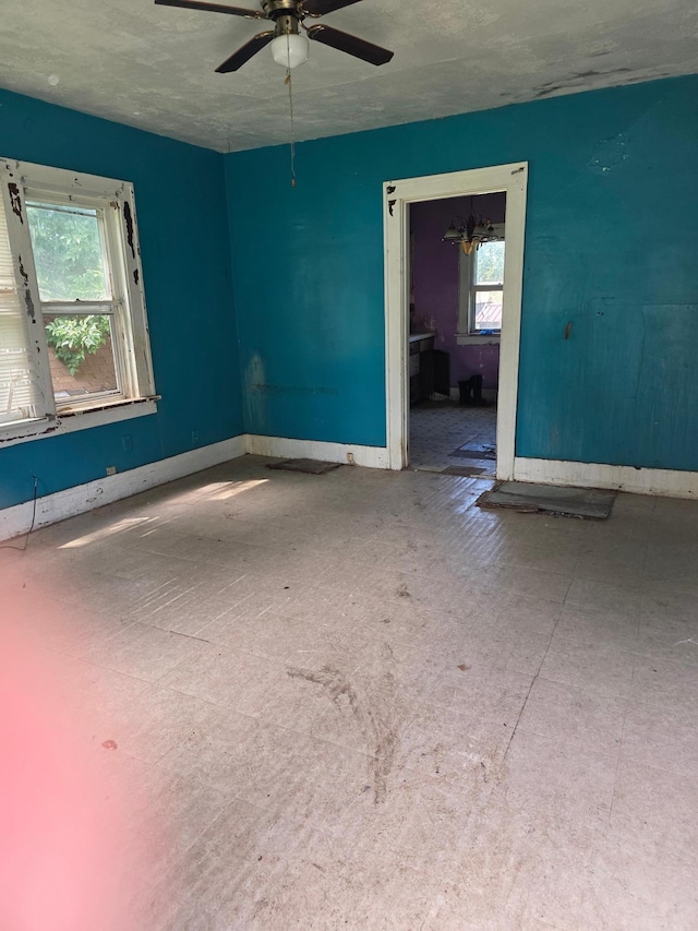 1637 Miller St, Worthington, MN 56187 - unfurnished room with a ceiling fan and baseboards