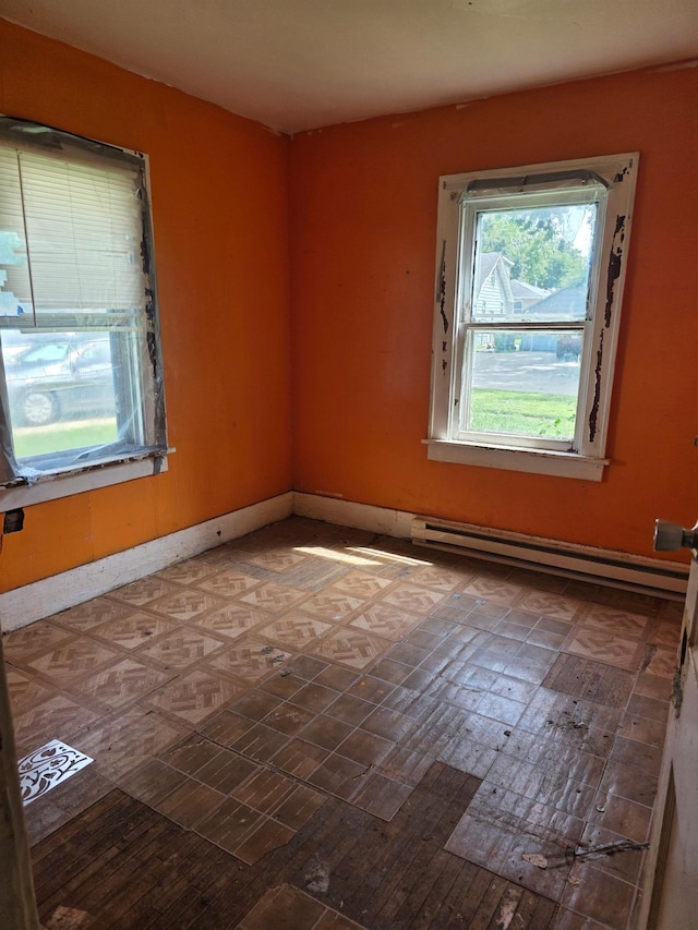 1637 Miller St, Worthington, MN 56187 - empty room featuring a baseboard radiator