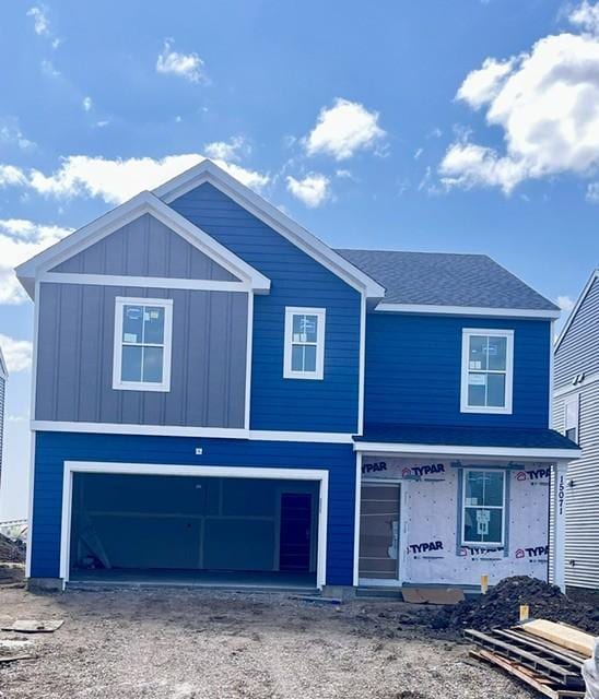 15071 Athgoe Dr, Rosemount, MN 55068 - view of front of home with a garage, driveway, board and batten siding, and a shingled roof