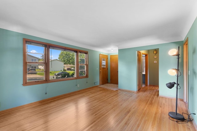 4251 Quincy St NE, Columbia Heights, MN 55421 - empty room featuring light wood-style floors and baseboards