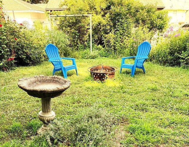 4251 Quincy St NE, Columbia Heights, MN 55421 - view of yard featuring an outdoor fire pit