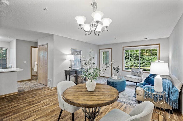 8484 Minuteman Alcove, Eden Prairie, MN 55344 - dining room featuring a chandelier and wood finished floors