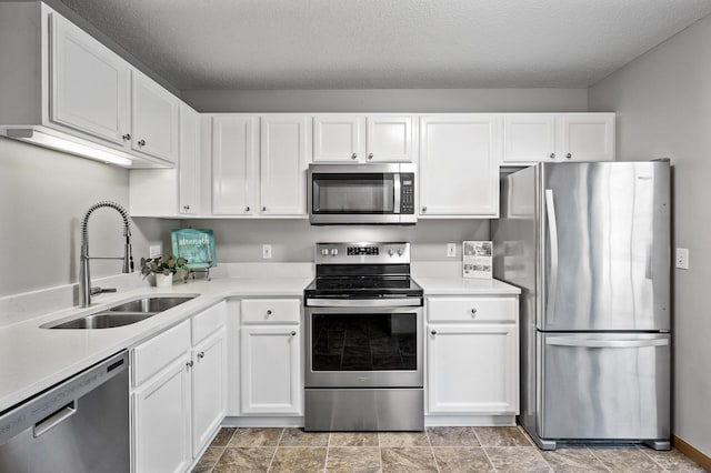 8484 Minuteman Alcove, Eden Prairie, MN 55344 - kitchen featuring appliances with stainless steel finishes, white cabinets, light countertops, and a textured ceiling