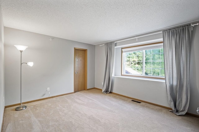 8484 Minuteman Alcove, Eden Prairie, MN 55344 - spare room featuring light colored carpet and a textured ceiling