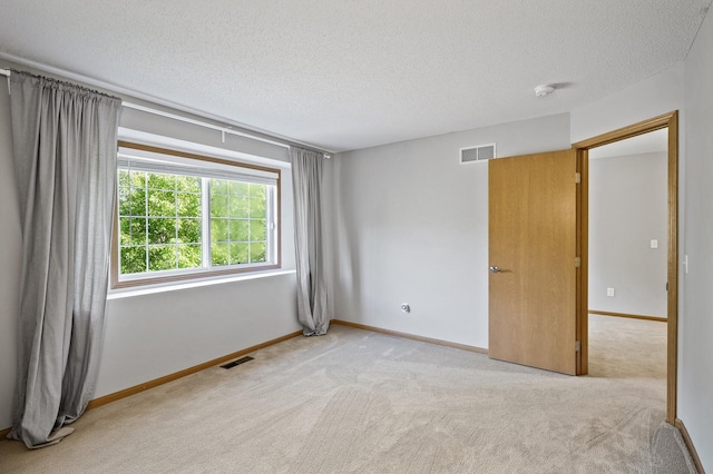 8484 Minuteman Alcove, Eden Prairie, MN 55344 - empty room with a textured ceiling, carpet flooring, and a smoke detector